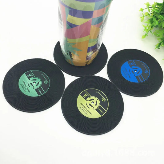 Elevate your home decor with these funky record coasters, boasting six different designs that bring a playful and retro vibe to any room.