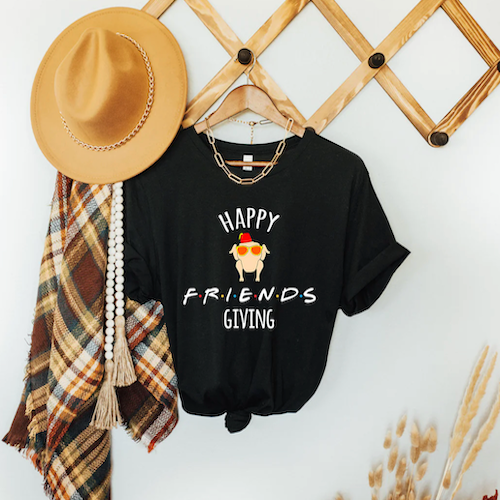 Black t-shirt that says Happy Friends Giving.